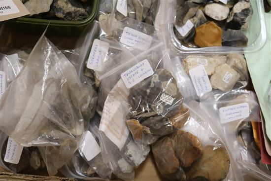 A stone fishing/loom weight and a large collection of prehistoric flint tools,